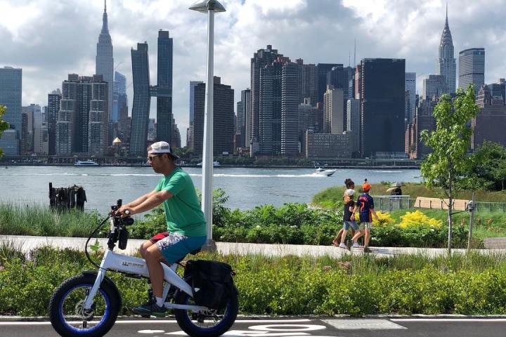 a person riding a motorcycle on a city street