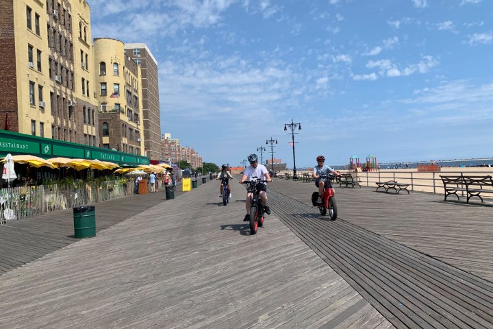 a group of people walking down the street