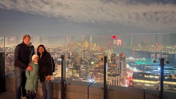 a person standing next to a traffic light