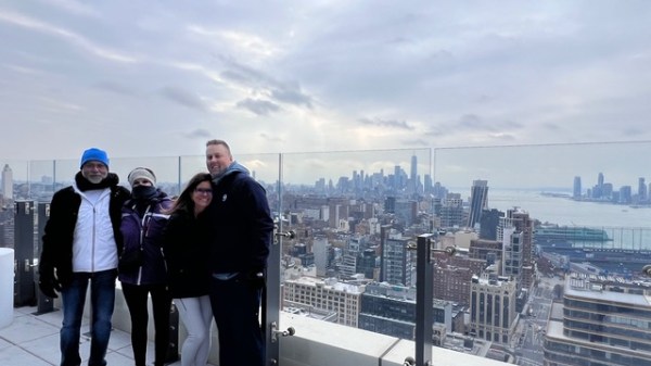 a group of people standing in front of a building
