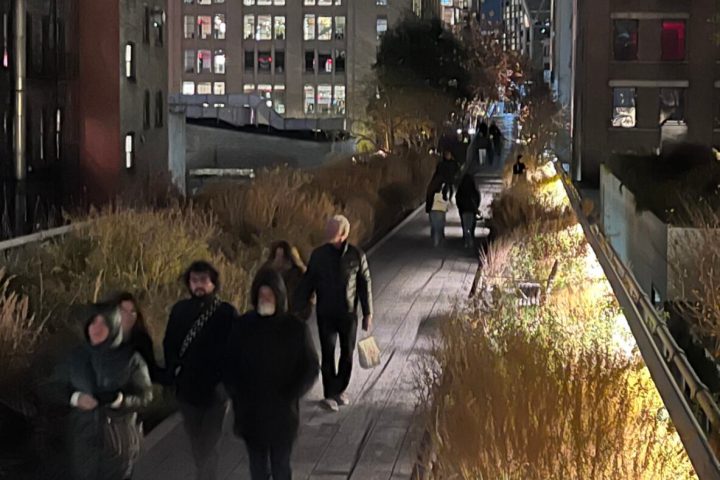 a group of people walking down the street