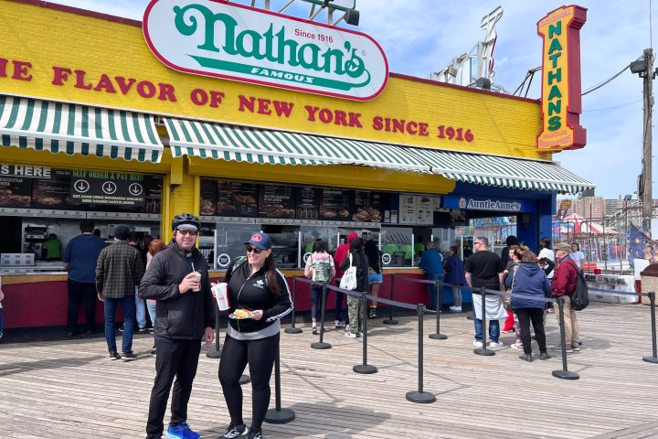 a group of people standing in front of a building
