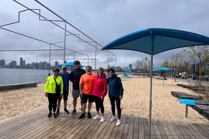 a group of people walking on a bridge