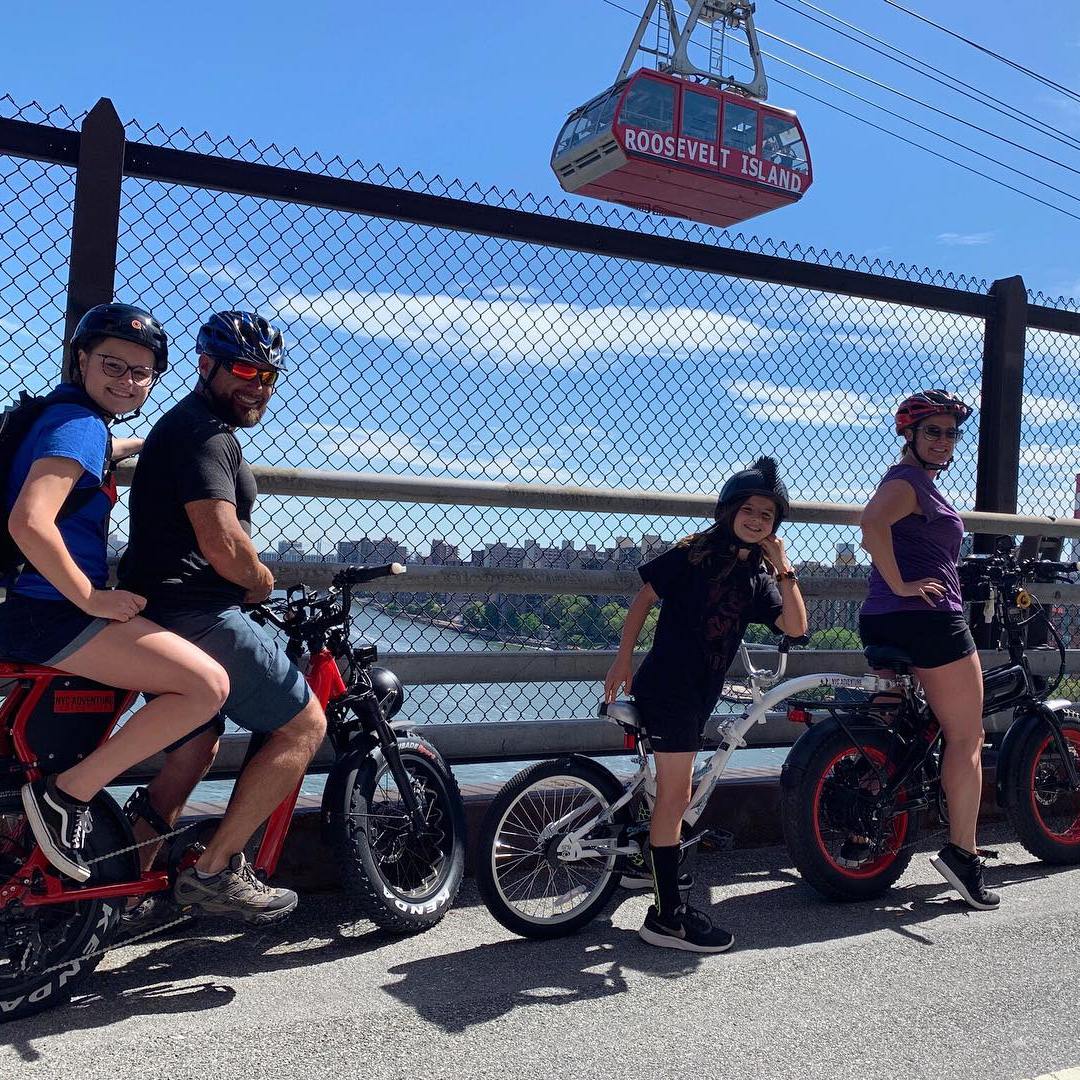 a group of people riding on the back of a motorcycle